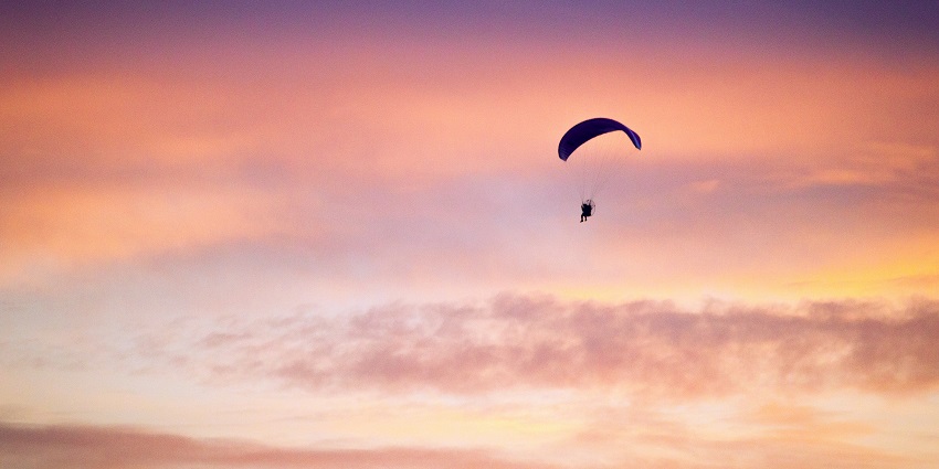 Sunset paragliding at the Bangalore outskirts with scenic skies and peaceful aerial views.