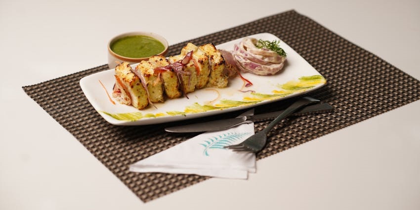 Paneer tikka served at Barbeque Nation, one of the best restaurants in Guwahati for lunch.