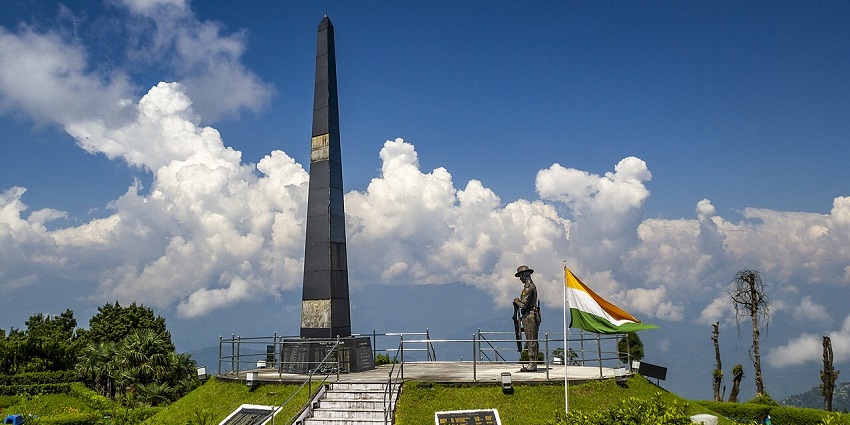Batasia Loop Gorkha War Memorial with soldier statue, Indian flag and tall tower, one of the offbeat places in Darjeeling.
