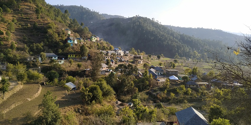 View of Bhaga Valley from Keylong showing the river, terraced fields, and high mountains.
