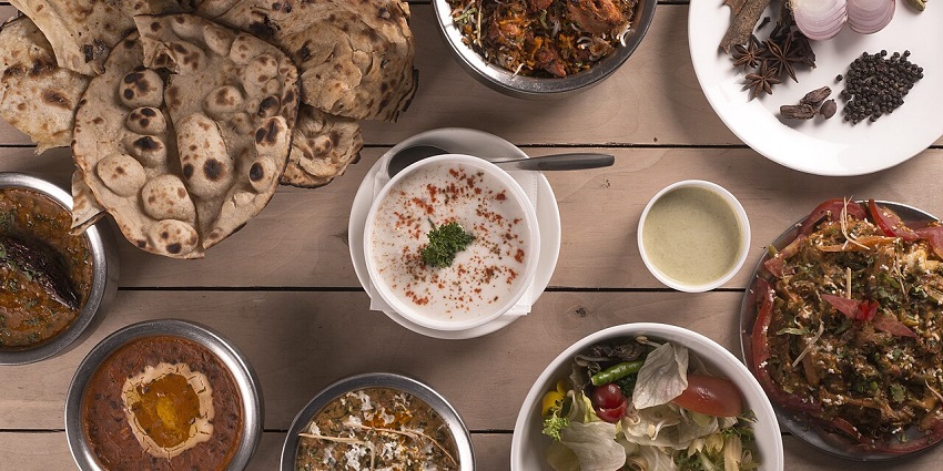 Variety of Indian dishes with naan, biryani, and curries served at Bombay Bistro, one of the Indian restaurants in Antalya Turkey.