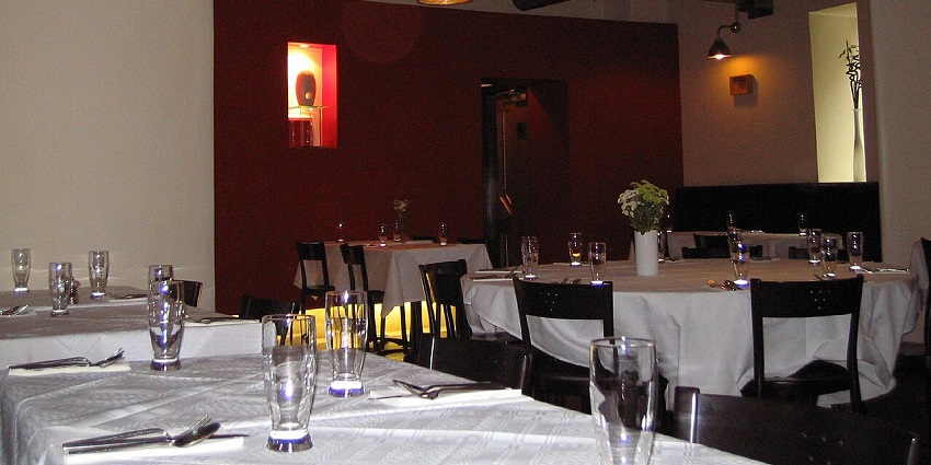 An empty and well-managed dining area of a restaurant is all set to welcome its customers at at one of the vegetarian restaurants in Havelock Island.