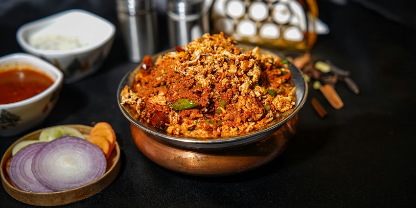 The dishes include items that appear to be curries (or stews), vegetables, and rice.
