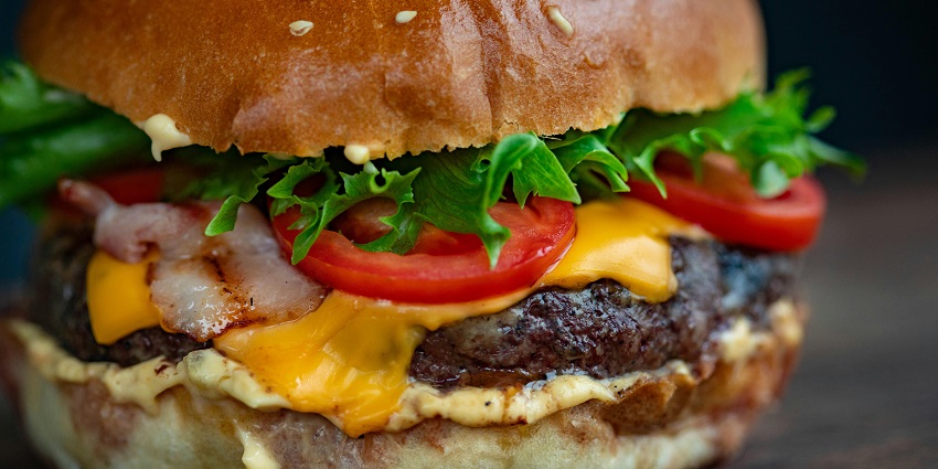 Delicious hamburger served on a plate at Burger Point restaurant.
