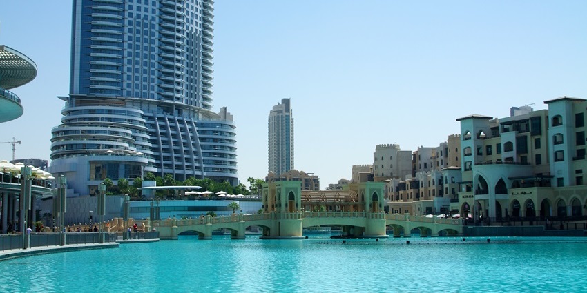 View of Burj Park on Burj Lake in Downtown Dubai with Burj Khalifa in the background.