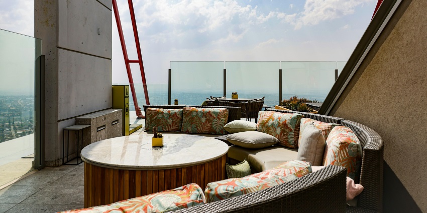 Cinnamon Terrace rooftop dining setup in the daytime, one of the popular Restaurants in Siliguri.
