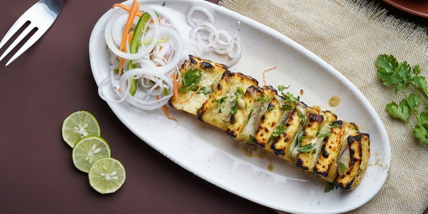 Paneer tikka with onions and peppers, a popular dish at restaurants in Jayanagar Guwahati.