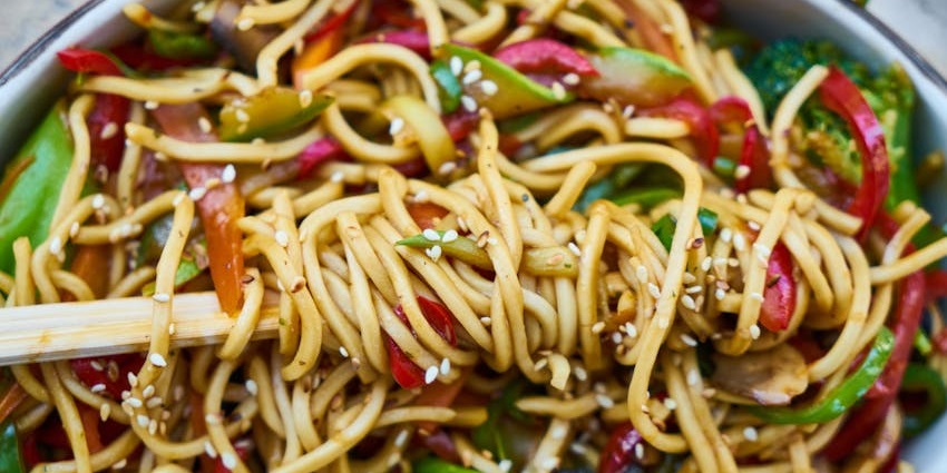A delicious bowl of noodles served at Confucius restaurant with elegant presentation.