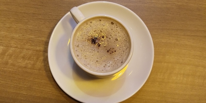 Close-up of a steaming cup of coffee, perfect for restaurants in Jayanagar Guwahati.