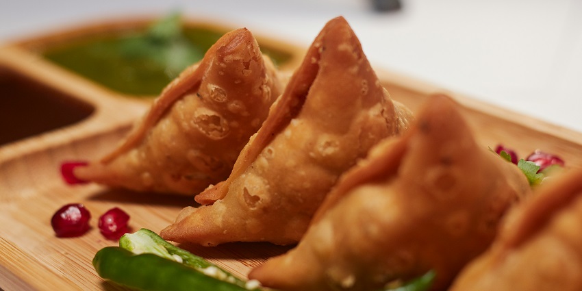 Famous Indian snack served with chutney at Dhaaba 47, showcasing traditional Indian flavours.
