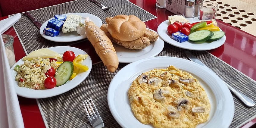 Continental breakfast spread with bread, salad, cheese & omelette at Druk Hotel Restaurant, one of the popular restaurants in Thimphu.
