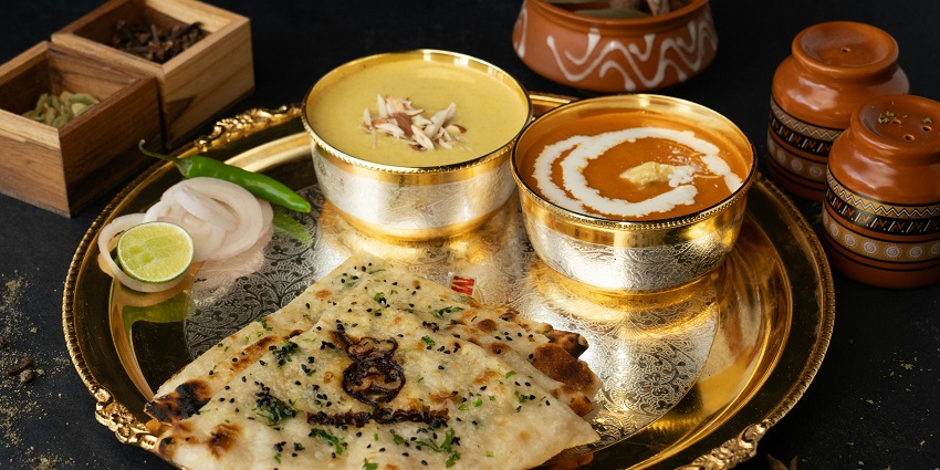 Indian thali with dal and naan served on a traditional plate at Dubb Indian Restaurant
