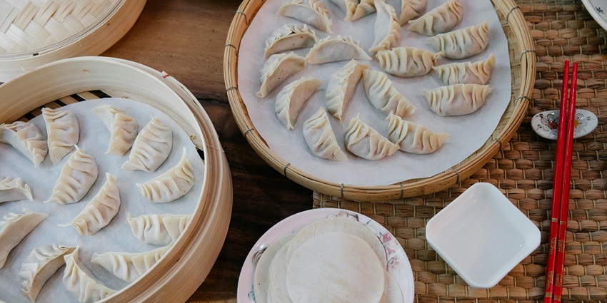 Chicken momos served in wooden boxes at the top restaurants in Dibrugarh.