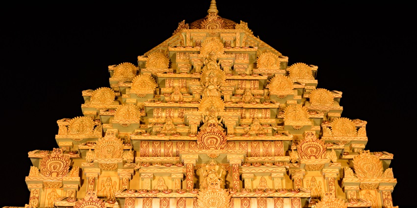Ekdalia Evergreen Durga Puja pandal featuring intricate carvings and artistic design.