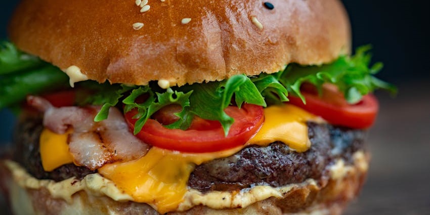 Burger served on a white plate at Fielding’s Local Kitchen & Bar.