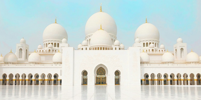 White mosque with domes at the Foundation of the Islamic Centre of Thailand, one of the stunning Mosques in Thailand.
