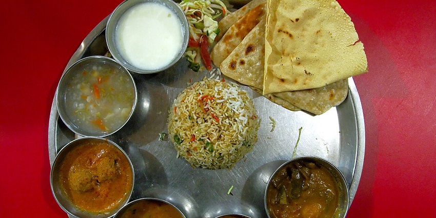 An Indian thali with paratha, a paneer dish, dal and rice is served at one of the vegetarian restaurants in Havelock Island.
