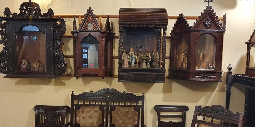 Wooden altarpieces and antique furniture are displayed at the Goa Chitra Museum in Benaulim, one of the museums in Goa.