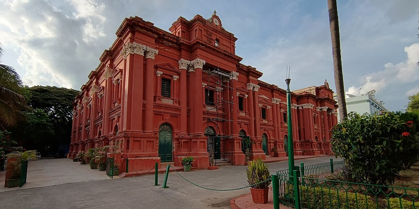 Historic red colonial-style building of the Government Museum in Bengaluru, Karnataka.