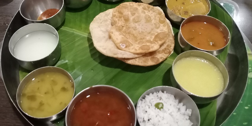 The South Indian comforting veg Thali is filled with various veg items like dal and pickle in one of the pure veg restaurants in Siliguri.