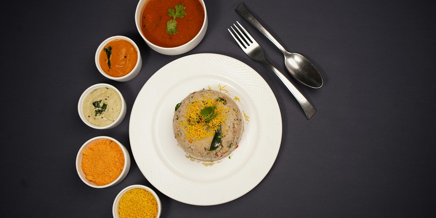 Upma with Sambhar and chutneys served at Greendot Restaurant, one of the popular pure veg restaurants in Gangtok.