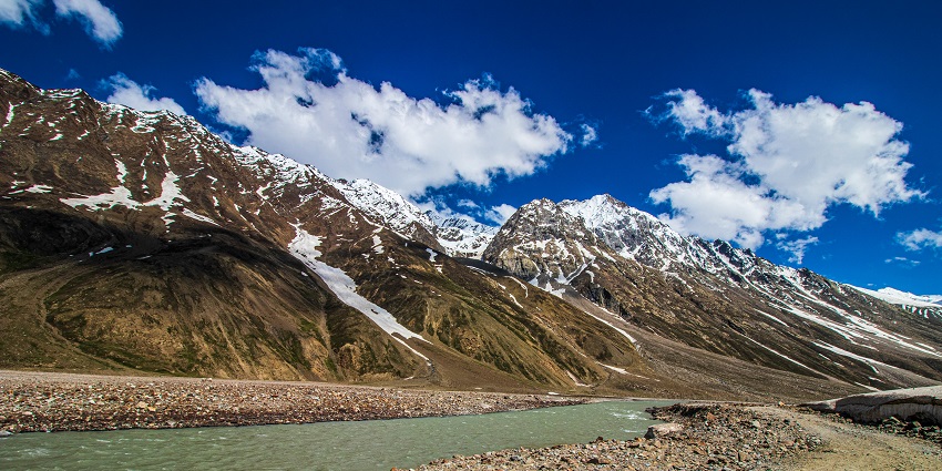 Spiti mountain range with the flowing river during the vibrant Halda Festival, festivals in Himachal Pradesh.
