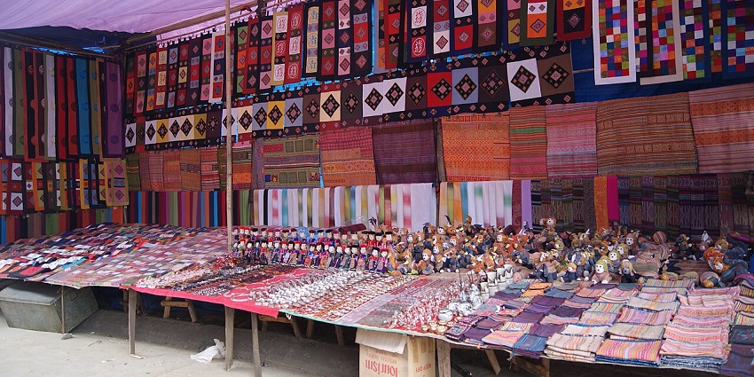 A shop at a Sunday market in Vietnam selling toys and items, ideal for shopping in Vietnam.
