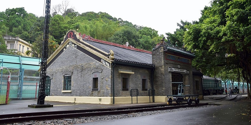 Hong Kong Railway Museum with a historic brick station building, tracks, and a signal post.
