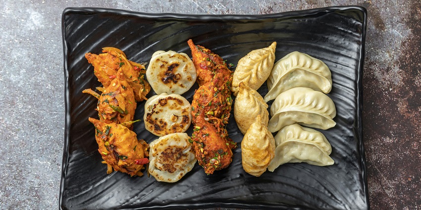 A platter of steaming momos served at Hot Stimulating Café.