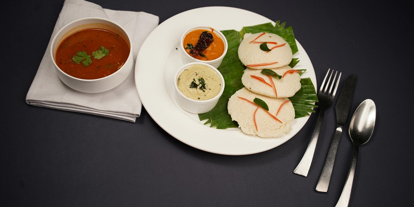 Idlis with sambar and chutney served at Hotel Kasturi Palace & Restaurant, one of the pure veg restaurants in Darjeeling.
