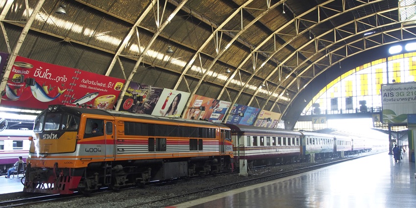 Hua Lamphong Station decorated with banners for monkey buffet festival in Thailand.