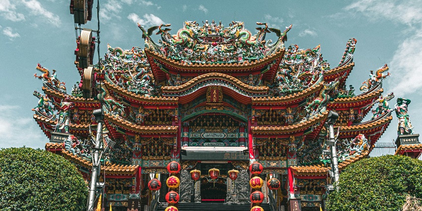 Exterior view of Hung Shing Temple with stairs and intricate architecture, one of the iconic temples in Hong Kong.