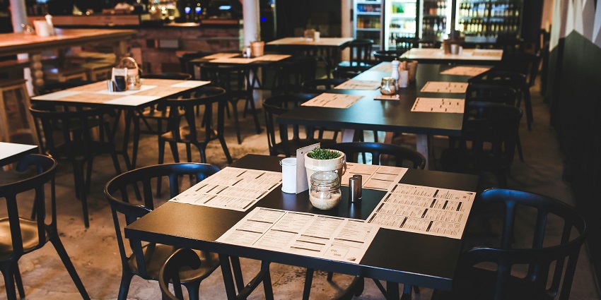 A restaurant dining area with multiple tables and chairs, one of the popular south indian restaurants in Singapore.
