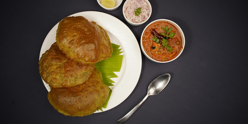 Indian curry served with puris at Jain's Midway Restaurant.