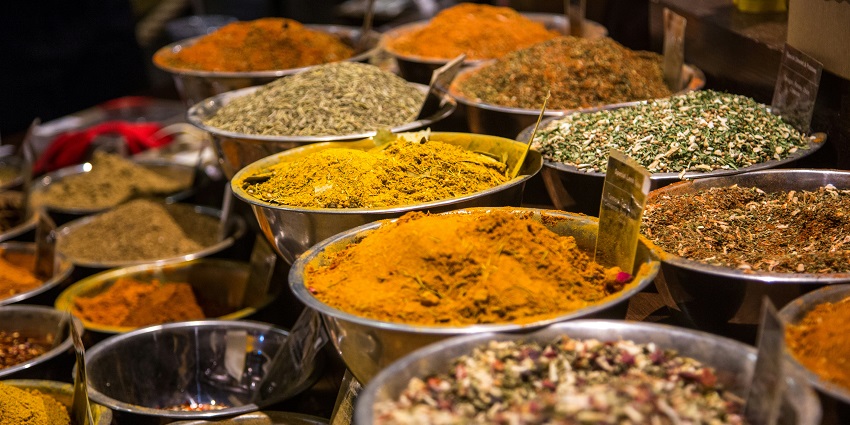 Spice stall close-up at Janatha Bazaar, showcasing vibrant spices in Karnataka’s shopping scene.
