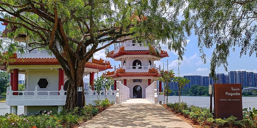 Jurong Lake Gardens with twin pagodas, lake, and buildings, one of the beautiful parks in Singapore.
