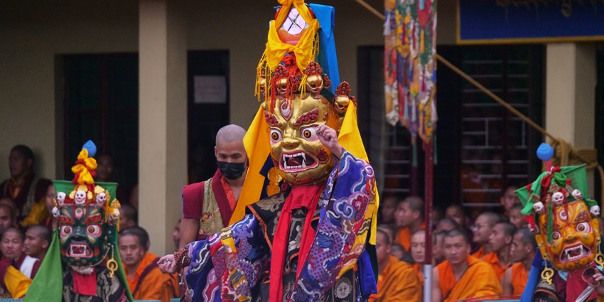 Members of the Tibetan Community wearing mascot perform the Chaam Dance at a monastery.