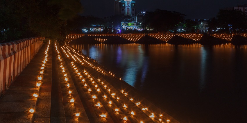 Row of oil lamps lit during Karthigai Deepam at Arulmigu Kapaleeswarar Temple.