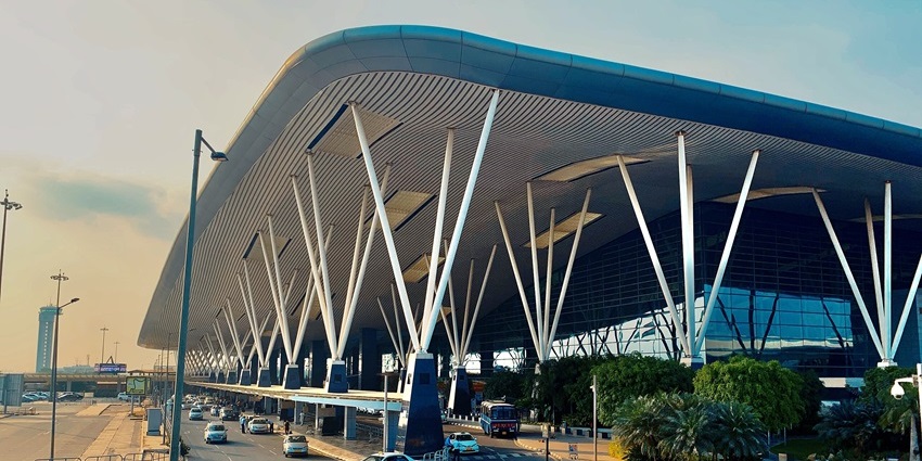 Modern glass and steel terminal building at Kempegowda International Airport in Bengaluru, one of the airports in Karnataka.