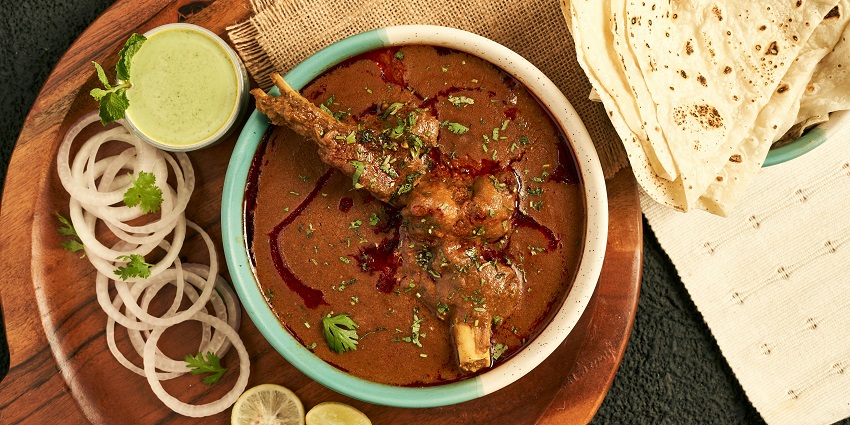 Top view of a creamy meat dish with flatbread at Keyif Restaurant, one of the Indian restaurants in Cappadocia Turkey.
