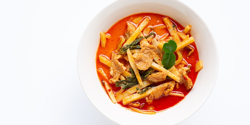 Flavorful bamboo shoot pork curry served hot at top restaurants in Agartala – a local delicacy.