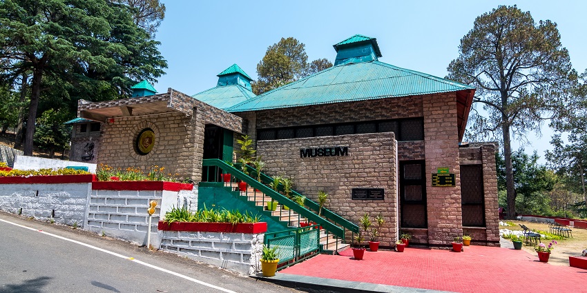 Entrance of the Kumaon Regimental Centre Museum with military displays and signage.