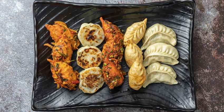 Steaming platter of assorted momos served hot at Kunga Restaurant.
