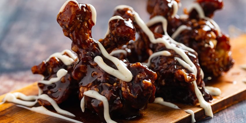 Plate of chicken wings served at LOCAL Public Eatery in a casual restaurant setting.