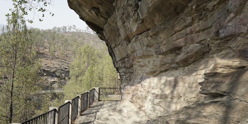 Rocky cave entrance with ancient petroglyphs at Lakhudiyar Caves, Uttarakhand.
