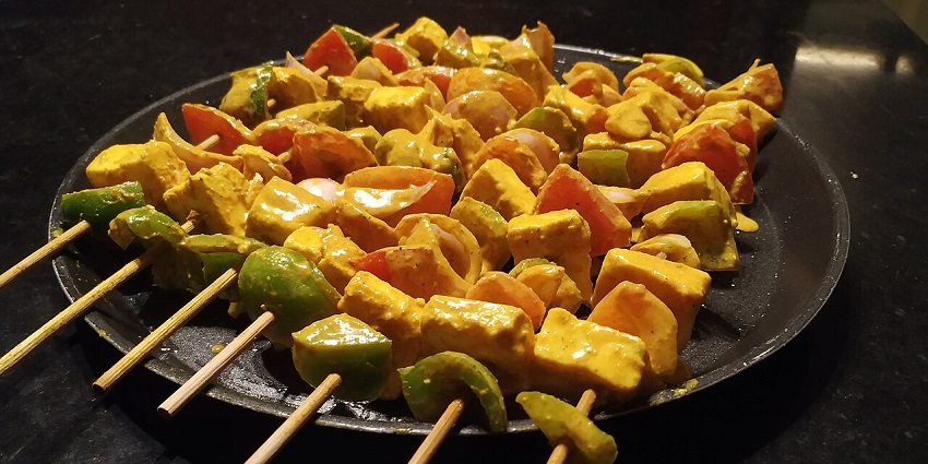 Deliciously marinated paneer and vegetable skewers, prepared for a delightful barbecue, in one of the Indian restaurants in Kuala Lumpur.
