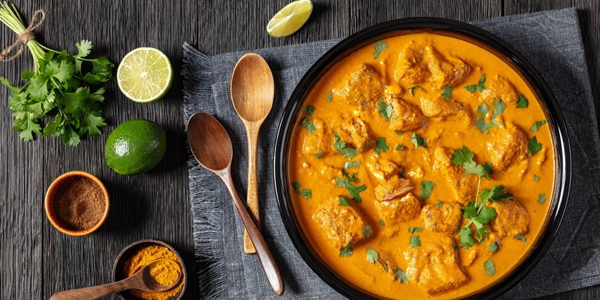 Traditional Assamese sour fish curry, Masor Tenga, served in a bowl.