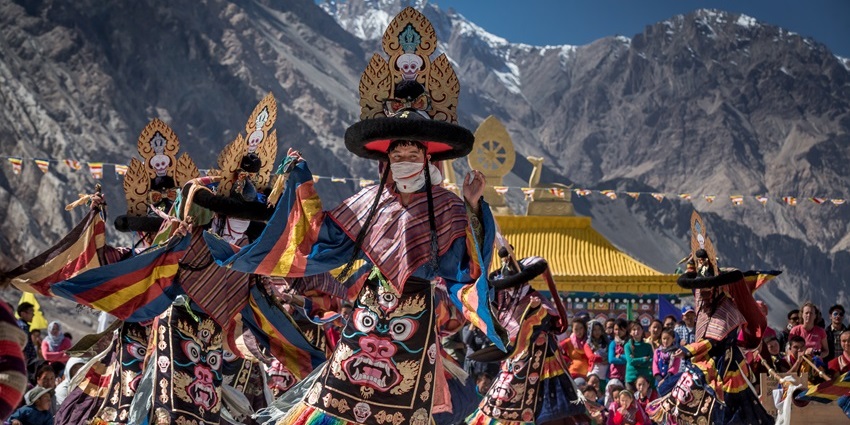 Monks and locals celebrate the Losar Festival with traditional dances and rituals in Ladakh.