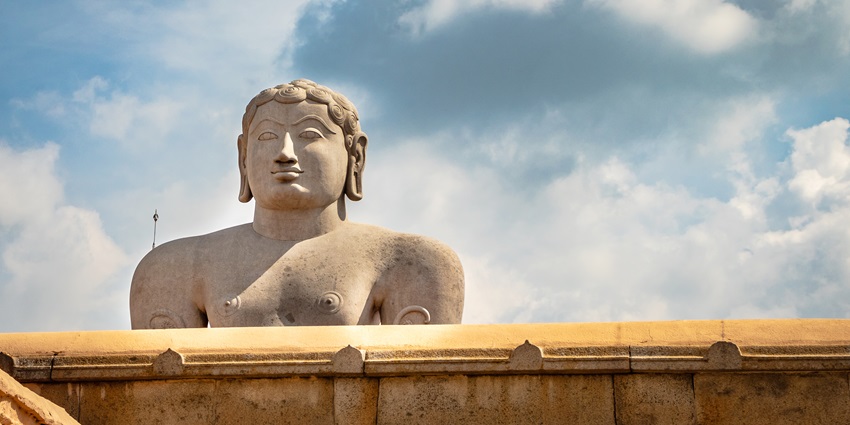 Devotees gather as the statue of Lord Bahubali is anointed during Mahamastakabhisheka