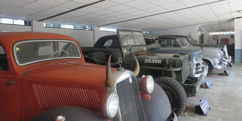 Vintage cars, including classic Mercedes models, are displayed at Manjusha Car Museum, Karnataka.